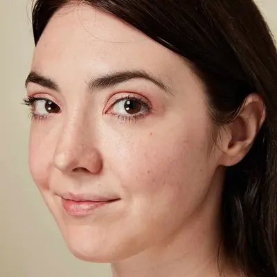 Close up of a woman, her makeup set with powder