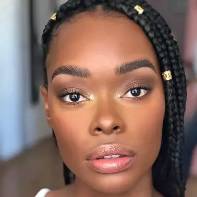 Woman with neutral makeup with a touch of glitter at inner eye corners