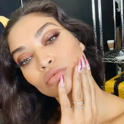 Shanina Shaik wears copper glitter flame winged eye makeup