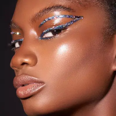 Model with bedazzled graphic eyeliner