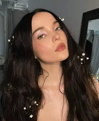 Dove Cameron models a shimmering, soft lilac glitter eyeshadow look