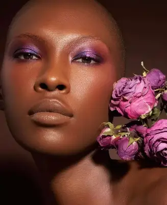 model is wearing vivid metallic purple shadow on the eyelids