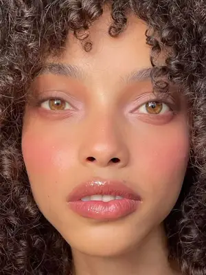 model wearing lilac and pink makeup