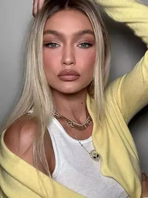 gigi hadid wearing glossy lips and shimmery eyeshadow