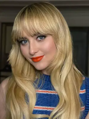 model wearing red orange lipstick