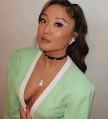 White cut out eyeliner on actress ashley park 