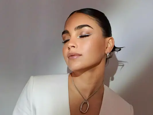 Actor Melissa Berrera with glowy, natural-finish makeup