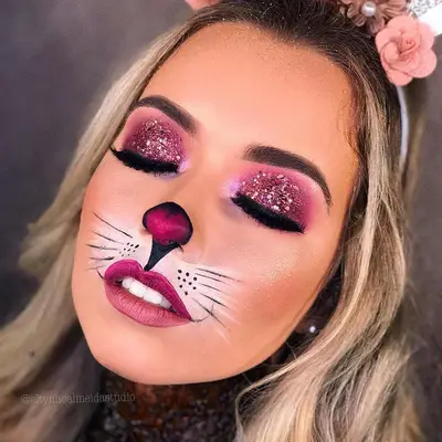 Model wears glam bunny makeup look with pink glitter eyeshadow