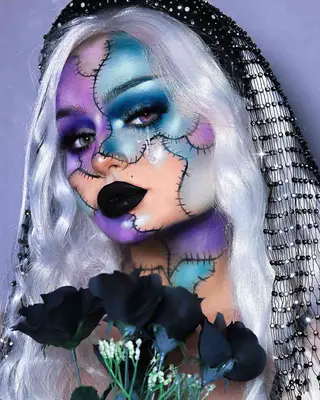woman with blue and purple patchwork bride of frankenstein monster makeup