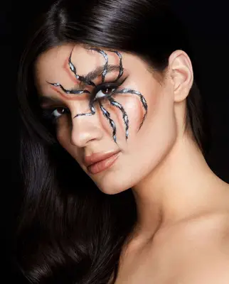 woman with furry tarantula makeup on her eye