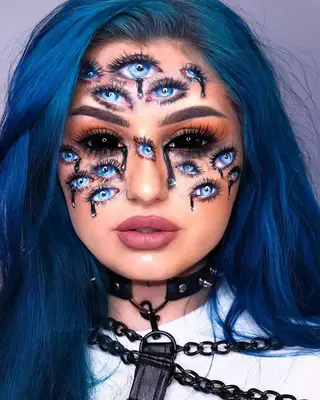 woman with blue hair and eyes makeup