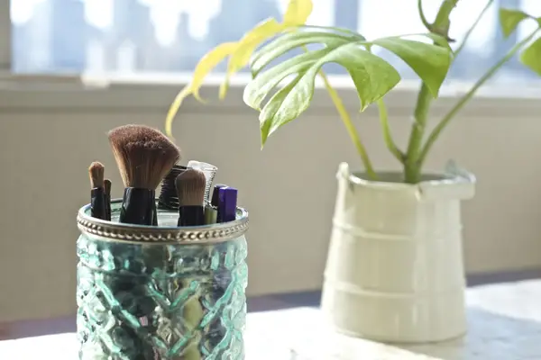 Makeup brushes in jar