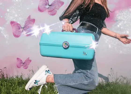 woman carrying blue caboodle