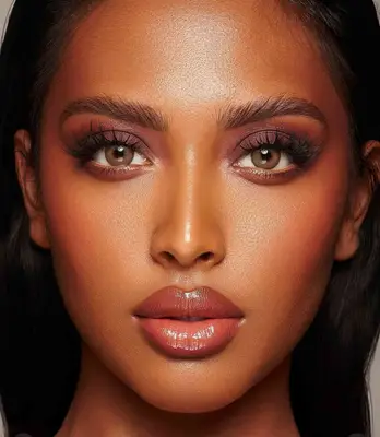 model wears plum smoky eyeshadow look