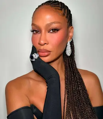 Joan Smalls wears a soft glam makeup look with winged eyeliner