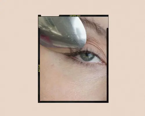 step one of curling lashes with spoon