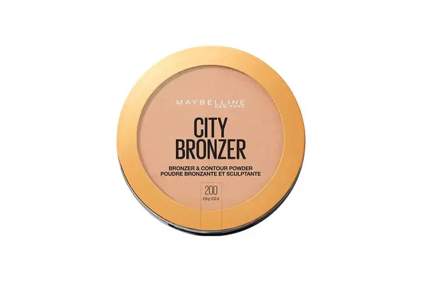 Person applying BLK/OPL Soft Velvet Finishing Powder to makeup brush from product