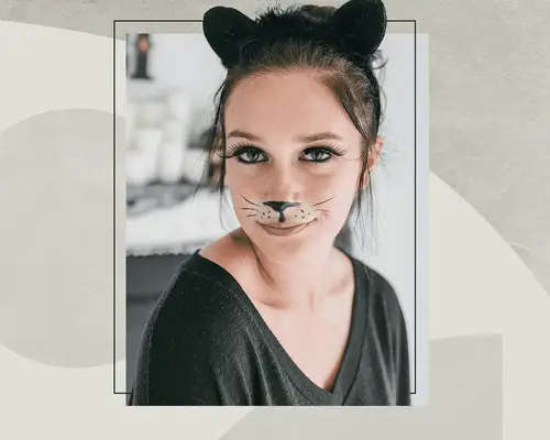 person with cat ears and halloween makeup