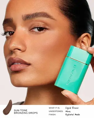 model holding Westman Atelier bronzing drops