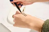 Person tests COVERGIRL Exhibitionist Lash Enhancing Liquid Eyeliner