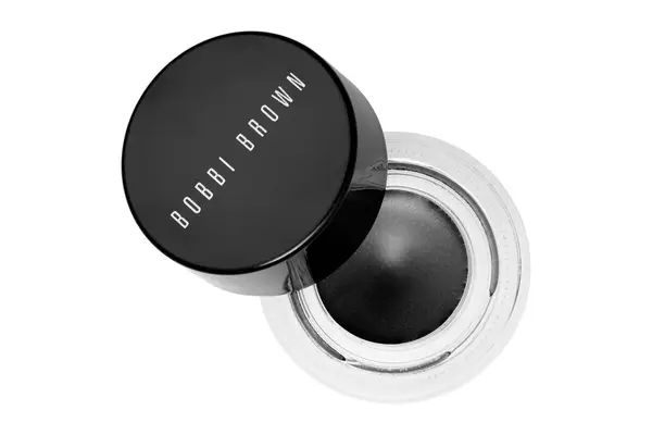 Hands holding a Benefit Cosmetics BADgal BANG! 24-Hour Waterproof Eyeliner