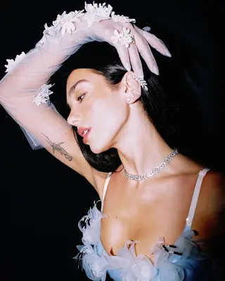 Dua Lipa wearing body glitter.