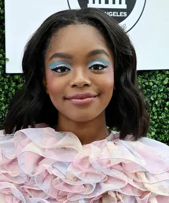 A young woman wears blue eyeshadow in two hues