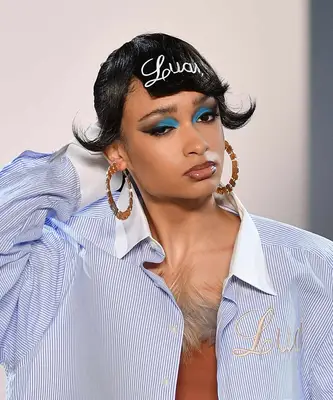 A model wears bright blue eyeshadow