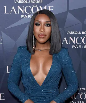 Jackie Aina wears glittery eyeshadow