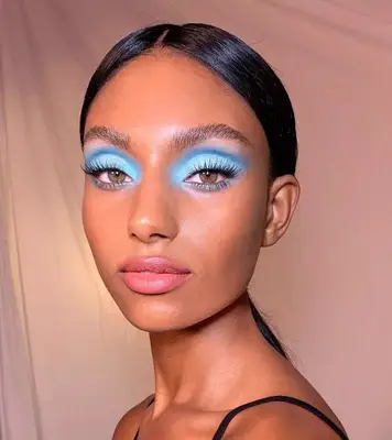 A model wears blue eyeshadows