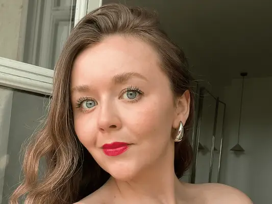 woman in red lipstick with long eyelashes