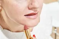 A person applies Pat McGrath Labs MatteTrance Lipstick