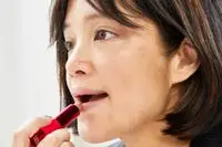 A person applies Natasha Denona I Need A Nude Lipstick