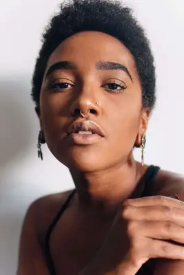 a woman with multiple facial piercings