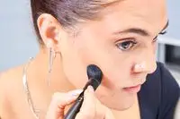 A person applies the Glo Skin Contour Kit