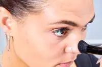 A person applies the Glo Skin Contour Kit