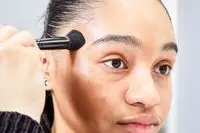 A person applies the Patrick Ta Major Sculpt Creme Contour & Powder Bronzer Duo