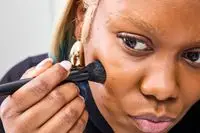 A person applies the e.l.f Cream Contour Kit Palette