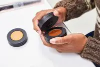 A person removes the top on the Melt Cosmetics The Sculpt Stack