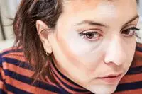 A person applies the Make Up For Ever HD Skin Cream Contour and Highlight Sculpting Palette