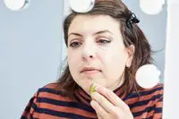 A person applies the Make Up For Ever HD Skin Cream Contour and Highlight Sculpting Palette