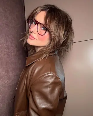 Katie Jane Hughes wears a brushed out blush look.