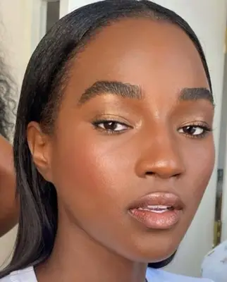 model wears visible champagne tone eyeshadow