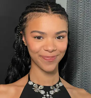 model poses wearing soft makeup look with light pink lipgloss