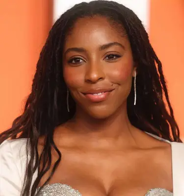 model poses wearing natural makeup look with coral blush