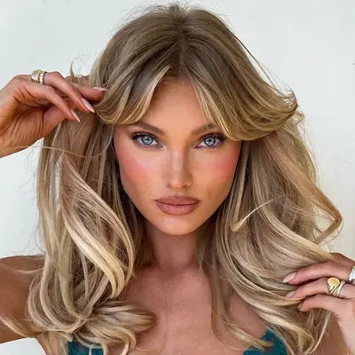 Elsa Hosk wears bright pink blush and a subtle smoky eye