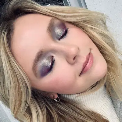 MYM Beauty editor Holly Rhue wears metallic eyeshadow and dark eyelashes