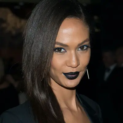 Joan Smalls wears black lipstick and blue eyeliner