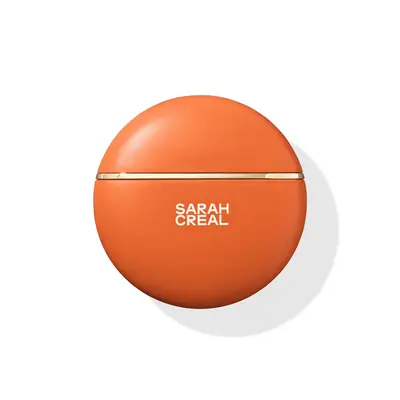 Orange circle sunscreen bottle with a white label