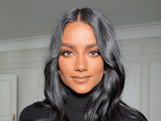 woman in soft glam makeup look staring into camera